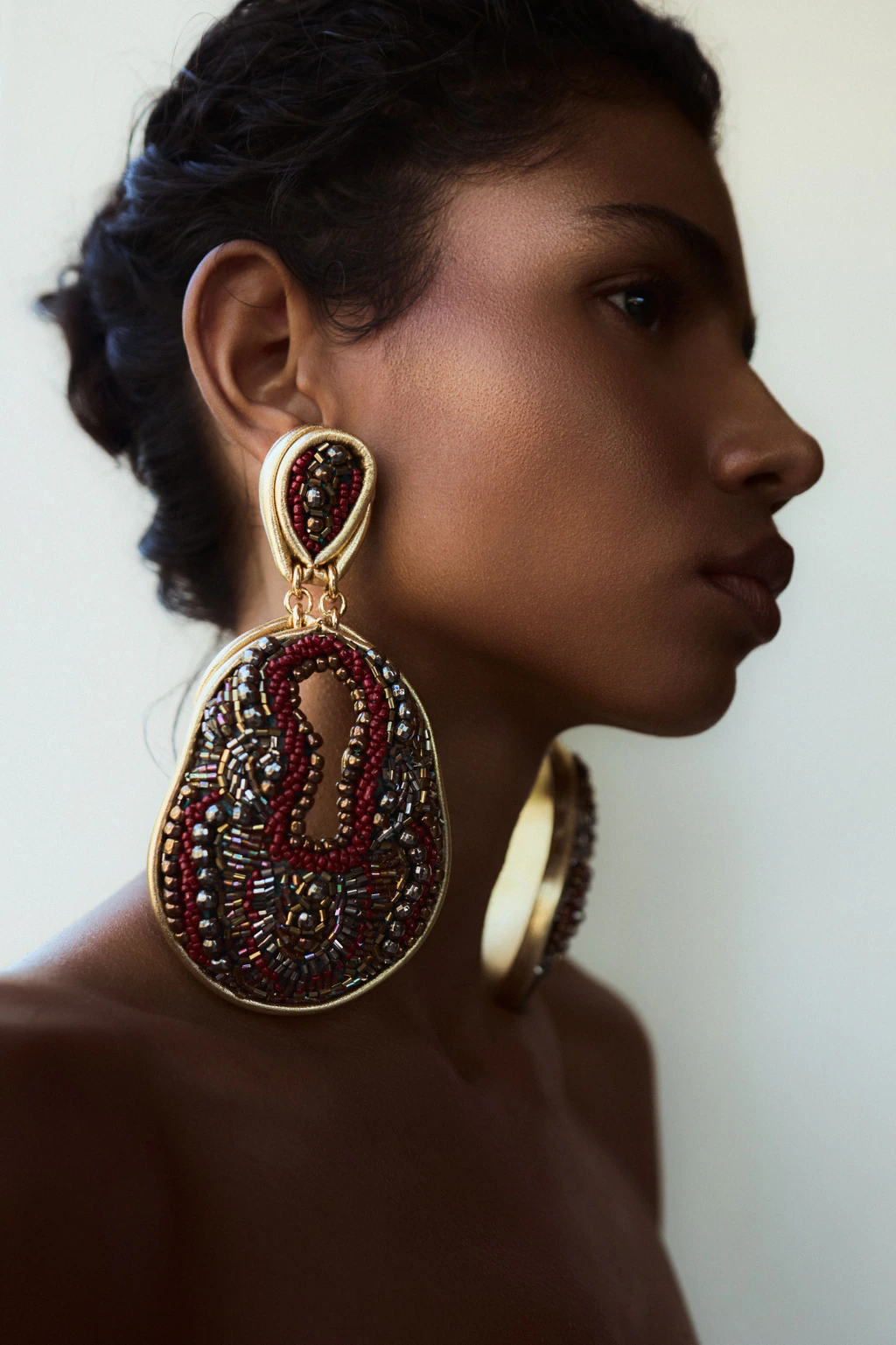 Handmade Brazilian beaded statement earring by HISHA worn in profile
